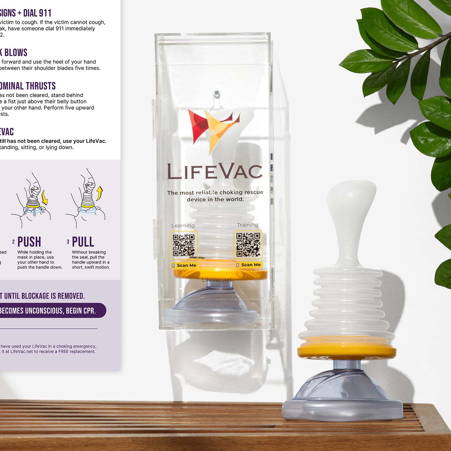LifeVac device inside wall mounted case with another device to its right and poster to its left